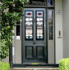 the front door to a house with two glass panels on it's side window