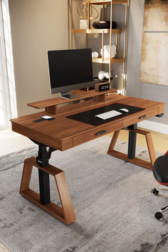 a computer desk sitting on top of a carpeted floor next to a wall mounted monitor