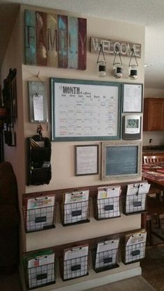 there is a wall with several baskets on it and some signs above the bins