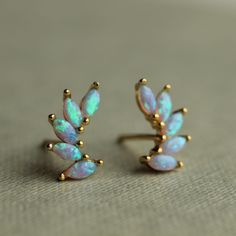 These delicate opal stud earrings are made of turquoise and blue opal and gold plated sterling silver, formed into tiny wings or crescents.  They have an amazing glowing quality and when they catch the light, flecks of gold and turquoise light up from within.  They are really beautiful and unusual. The stud or post earrings measure just 7mm in length. The opals are set into gold plated sterling silver.  The butterfly backs are made from gold plated sterling silver.   🖤 FASTER SHIPPING 🖤 Need t Formal Opal Gemstone Earrings, Luxury Elegant Opal Earrings, Opal Earrings For Anniversary - Fine Jewelry, Blue Opal Multi-stone Jewelry, Sister Birthday Gift, Blue Opal Earrings, Opal Stud Earrings, Preppy Jewelry, Opal Earrings Stud