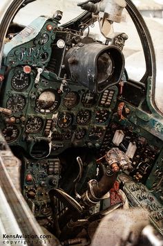 the cockpit of an old airplane with many buttons and dials on it's windows