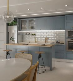 a modern kitchen with blue cabinets and white counter tops, an island in the middle