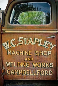 an old truck with the words w c stapley machine shop and welding works campbell