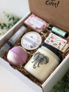 an elephant themed gift box with candles, soaps and other items