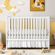 a baby's room with a white crib and toy animals on the floor