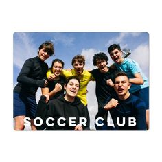 a group of young men standing next to each other in front of the words soccer club