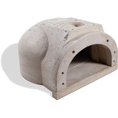 a cement oven sitting on top of a white surface