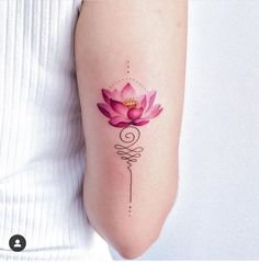 a woman's arm with a pink flower tattoo on the back of her left arm