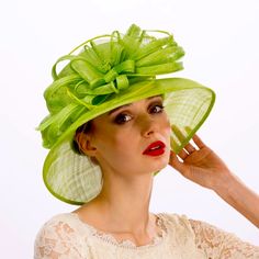 Sinamay Ribbon Flower Is Centered With Pips, Backed With Sinamay Strips Creating A Classic Design Making It Perfect For Summer Events. The Medium Down Turned Brim Is Perfect For Creating Shade. The Hat Is Topped With Feathers Giving It A More Luxurious Feel. Spring Beach Fascinator, Fitted, Spring Beach Fascinator, Green Mini Hat With Short Brim For Spring, Green Mini Hat For Royal Ascot, Wide Brim Green Mini Hat For Spring, Green Wide Brim Mini Hats For Spring, Green Hats For Kentucky Derby, Spring Green Wide Brim Mini Hat, Green Spring Hats For Church