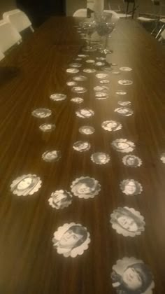 a long table with many plates on it and chairs in the back drop off area