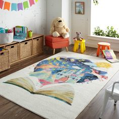 a child's playroom with toys, books and stuffed animals on the floor