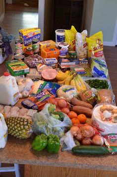 a kitchen counter covered in lots of food