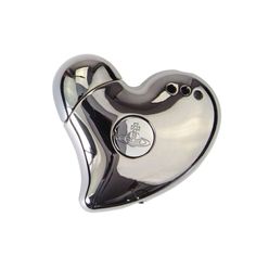 a silver heart shaped object with a black and white design on the inside of it