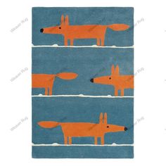 an orange and blue rug with two foxes on the opposite side, one is looking at another