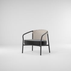 a black and white chair sitting on top of a white floor