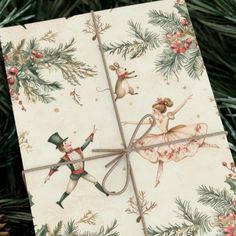 an ornament on a christmas tree decorated with dancing mice