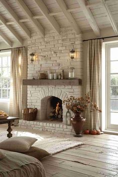 a living room filled with furniture and a fire place in the middle of a room