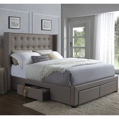 a bedroom with a bed, dresser and window in the background on a carpeted floor