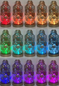 many different colored lights are in the shape of bottles with holes and circles on them