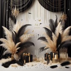 black and gold decorations with feathers on display in front of curtained backdrop, candles and chandelier