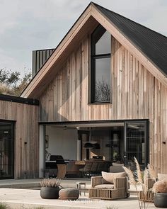 a large wooden house with lots of windows