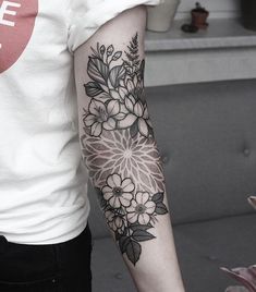 a person with a flower tattoo on their arm