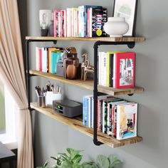 three wooden shelves with books and other items on them