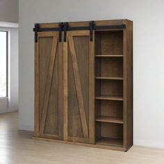 an open wooden bookcase with sliding doors on the front and side, against a white wall