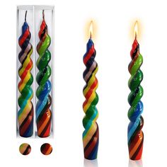 there are three candles that have different colors on them