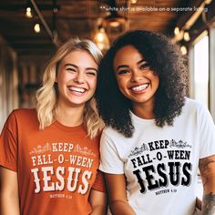 two women wearing t - shirts with the words jesus printed on them and smiling at the camera