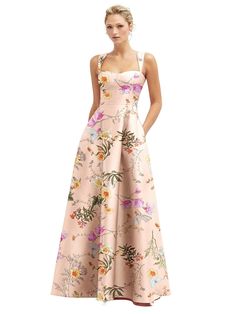 a woman in a dress with flowers on it