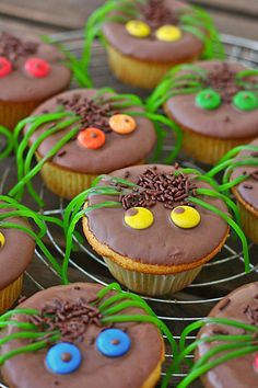 chocolate cupcakes decorated with spooky eyes and grass