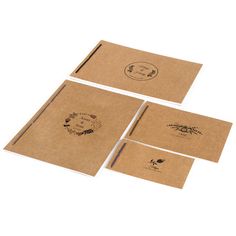 four pieces of brown paper on top of each other, with designs printed on them