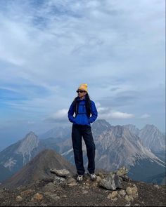 a person standing on top of a mountain