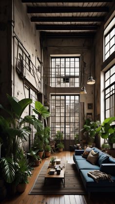 a living room filled with furniture and lots of plants on the wall next to large windows