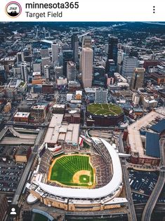 an aerial view of a baseball stadium in the city