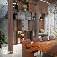 a dining room table and chairs in front of a wooden shelf with bottles on it