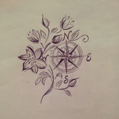 a drawing of a compass with flowers on it