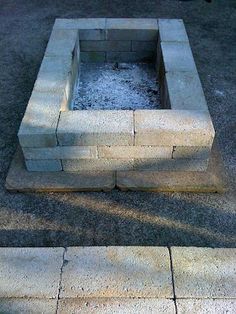 the fire pit is made out of concrete blocks