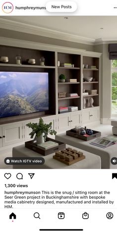 a living room filled with furniture and a flat screen tv on top of a wall