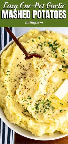 mashed potatoes in a bowl with butter and parsley