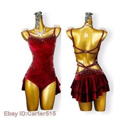 two female mannequins wearing red and gold outfits with beading on them