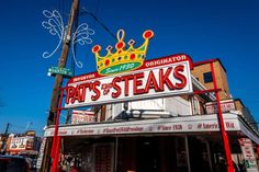 there is a sign that says pat's to steaks