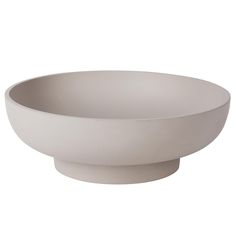 a white bowl sitting on top of a table