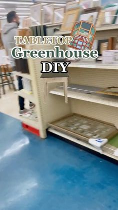 there is a store that has green house diy on the shelf in front of it