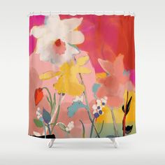 a colorful shower curtain with flowers painted on the front and back side, in bright colors