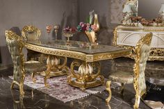 a fancy dining room set with gold furniture