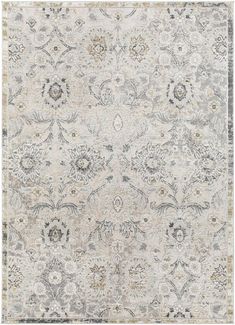 an area rug with many different colors and designs on the carpet, including greys