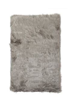 a gray rug with shaggy fur on the bottom and sides, against a white background