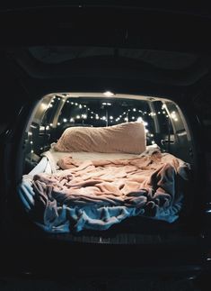 the bed is in the back of the truck with lights on it's sides